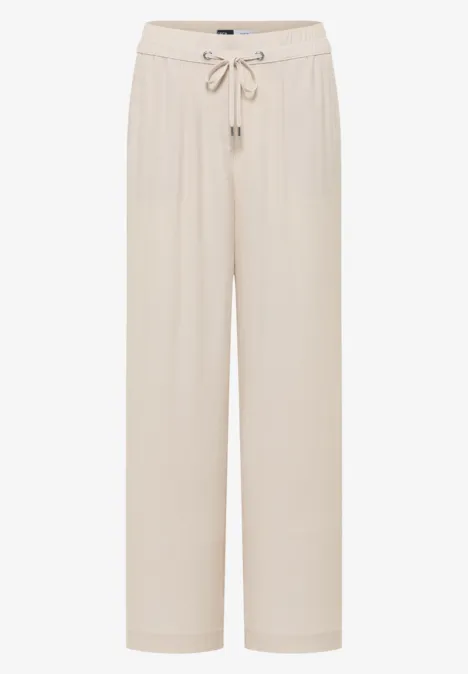 Pantalon ample de loisirs beige clair, taille élastiquée avec cordon de serrage.