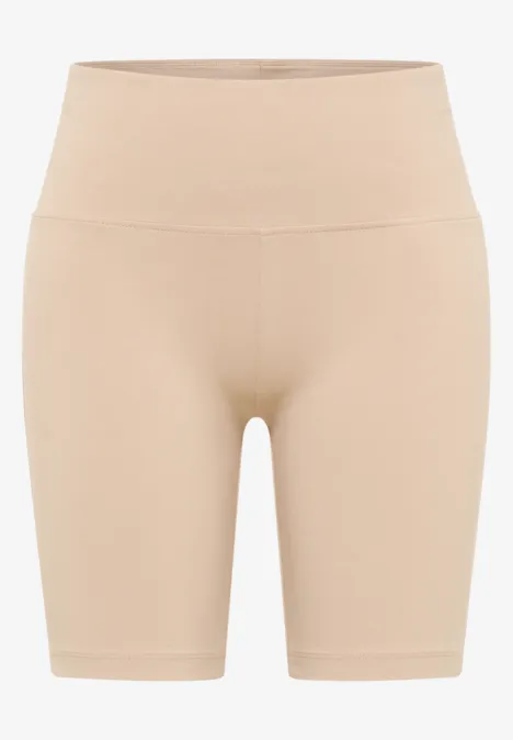 Beige, nahtlose High-Waist-Shorts aus elastischem Material, figurformend.