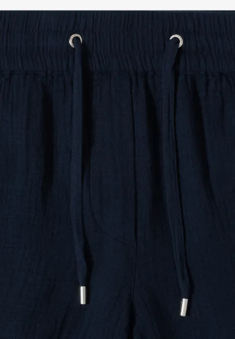 Dunkelblaue Baumwollhose mit Elastikbund und Kordelzug.