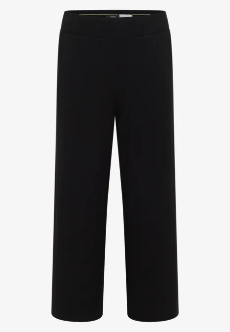 Schwarze, locker geschnittene Hose mit weitem Bein und elastischem Bund.