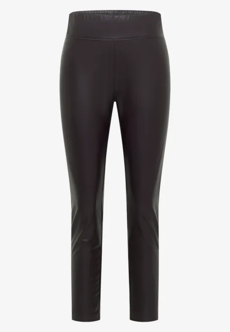 Zwarte, slanke legging tot op de enkel van glanzende stof met hoge taille.