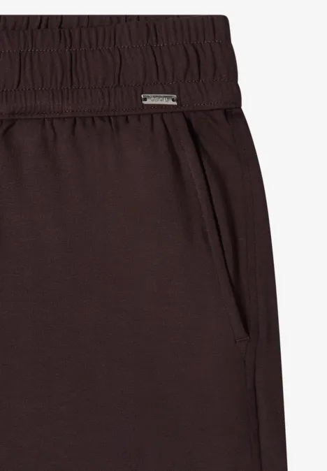Pantalon de jogging marron foncé, taille élastique, poche latérale et design épuré