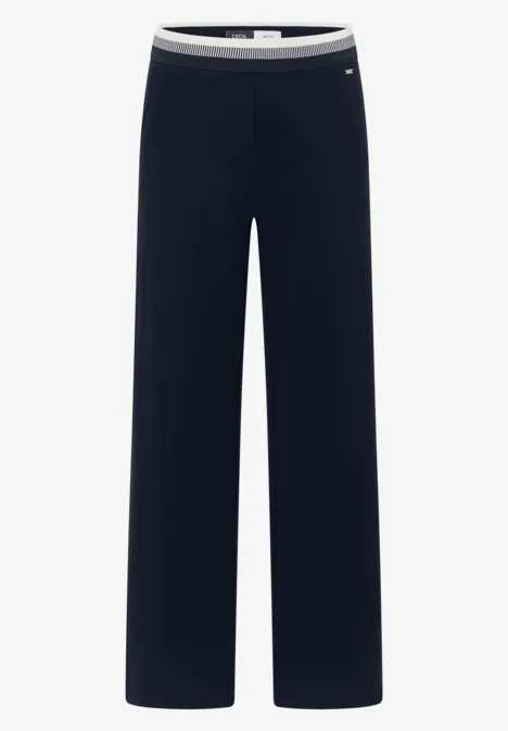 Pantalon ample noir au style épuré avec taille élastique.