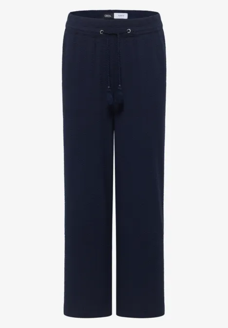 Donkerblauwe loungebroek met wijde pijpen en aantrekkoorde in de taille.