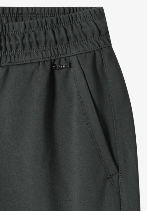 Zwarte sportbroek met elastische tailleband en zijzak.