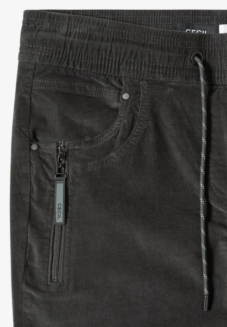 Pantalon en velours côtelé noir, taille élastique, cordon de serrage et poche zippée