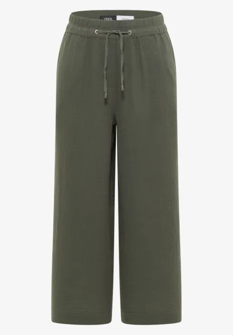 Olivgrüne, weite Stoffhose mit elastischem Bund und Kordelzug.