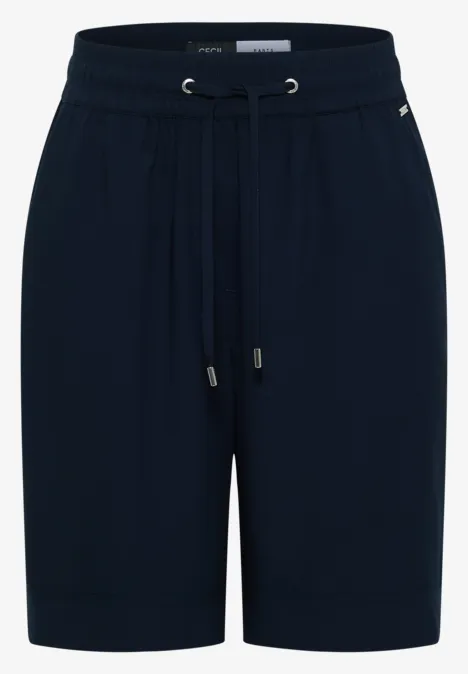 Schwarze Jersey-Shorts mit elastischem Bund, Kordelzug und seitlichen Taschen, knielang, bequem und casual.