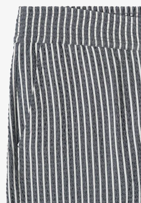Hoge taille broek met zwart-witte verticale strepen en zijzak.