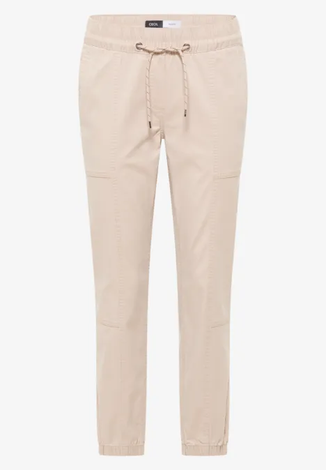 Beige, leichte Hose mit elastischem Bund, Kordelzug und schmalem Beinabschluss.