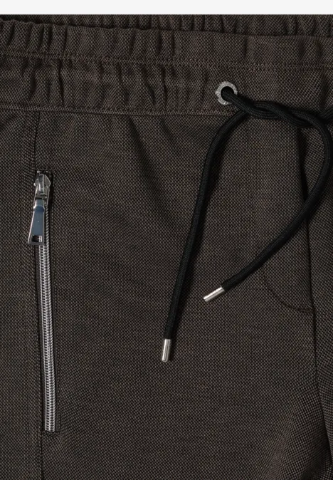 Pantalon taille mi-haute, coupe Slim Leg et style décontracté creamy mocha Dunkelgraue Jogginghose mit elastischem Bund, schwarzem Kordelzug und Reißverschlusstasche an der Seite.