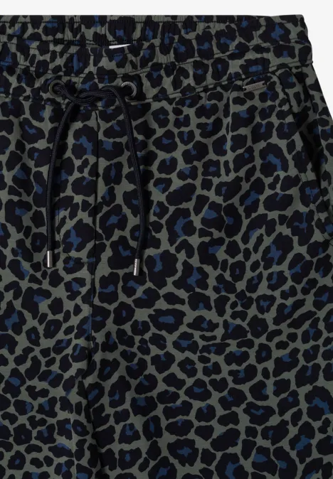 Pantalon de jogging gris à motif léopard bleu-noir avec cordon de serrage.