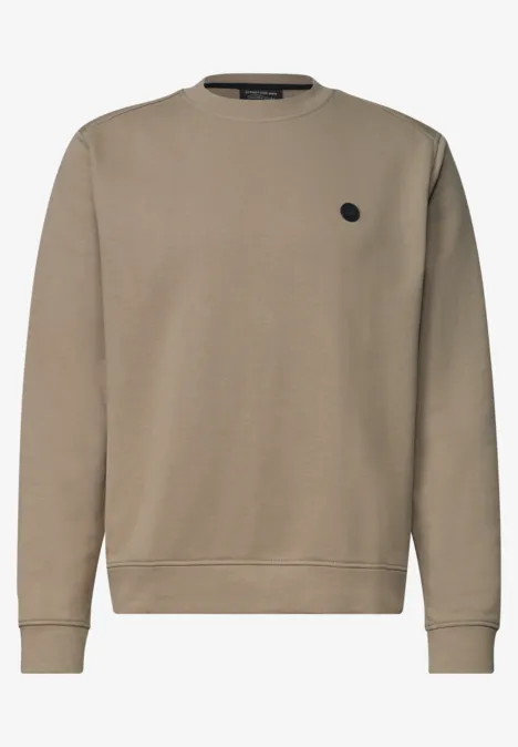 Sweat-shirt beige uni, col rond, manches longues et petit logo rond noir sur la poitrine.