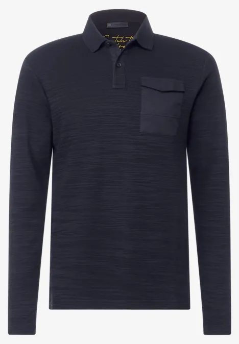 Polo manches longues bleu foncé avec poche poitrine.