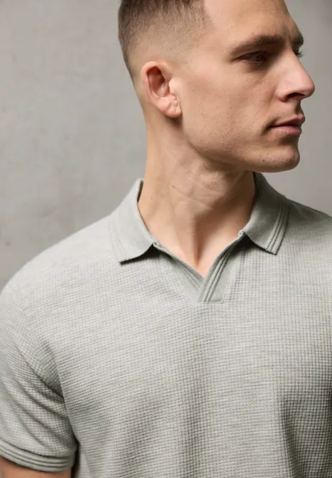 Poloshirt in effen kleur white sand