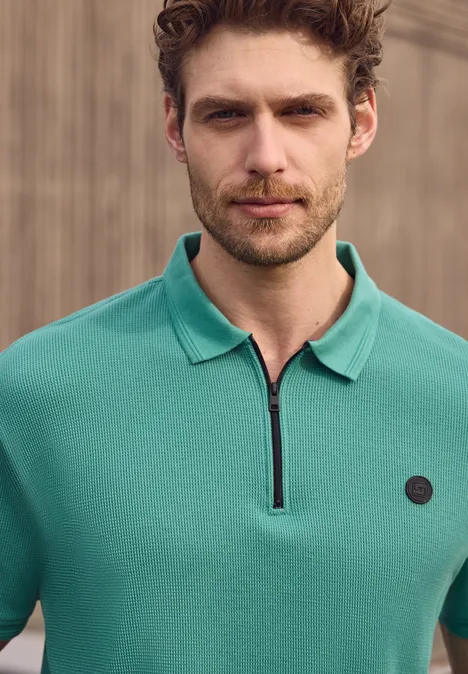 Polo zippé et structuré caribbean green