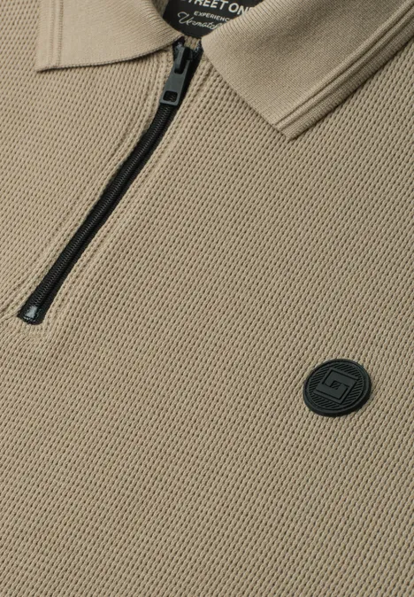 Poloshirt met lange mouwen en ritsdetail antique beige Beige gebreide polo met rits, kraag en rond zwart logo.