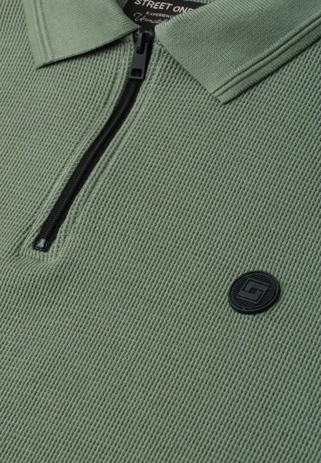 Poloshirt met lange mouwen en ritsdetail willow green Olivgroen poloshirt met ritssluiting bij de kraag en ronde logo-patch op de borst.