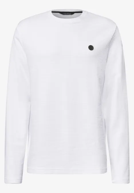 T-shirt à manches longues blanc, col rond et petit logo sur la poitrine