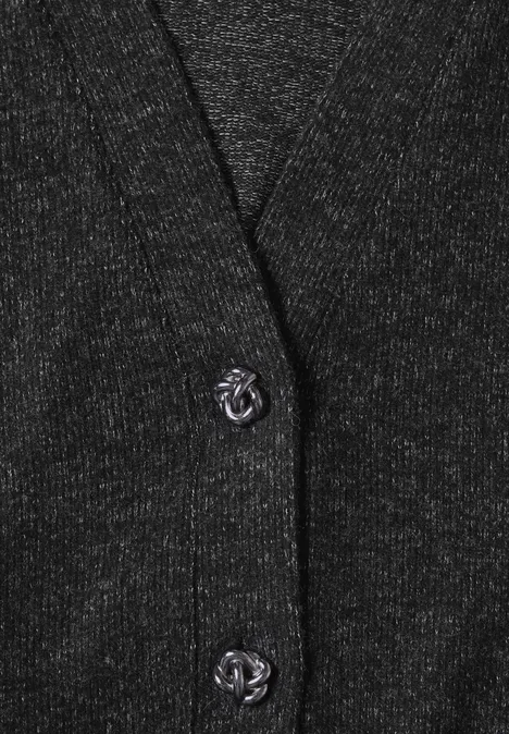 Cardigan en maille gris foncé pailleté avec deux boutons argentés ornés d’un logo