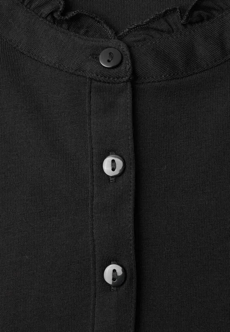 Shirt met lange mouwen, ronde hals en ruches Black Schwarzes Oberteil mit Rüschenkragen und drei Knöpfen in der vorderen Mitte.