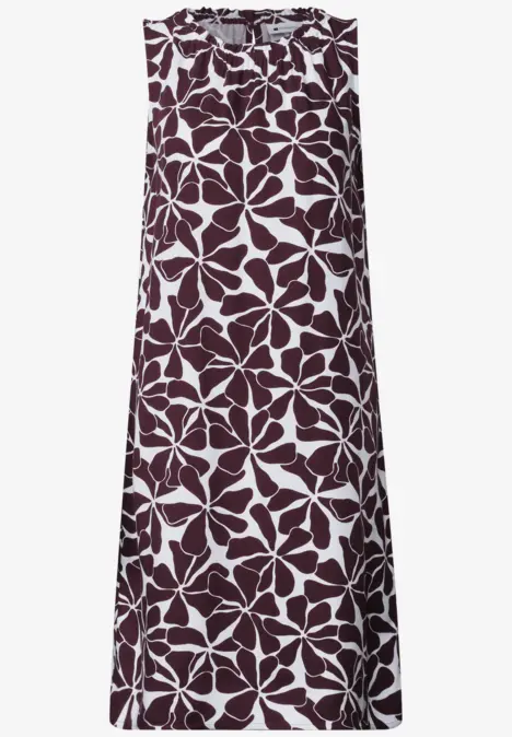 Robe droite sans manches blanche à gros motif floral bordeaux.