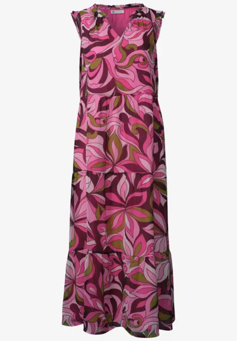 Robe longue rose à motif abstrait de feuilles dans des tons de fuchsia et brun.