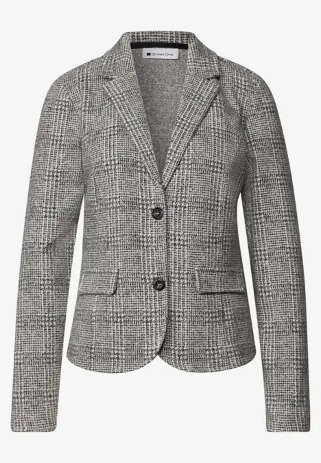 Veste femme cintrée à deux boutons, motif pied-de-poule noir et blanc.