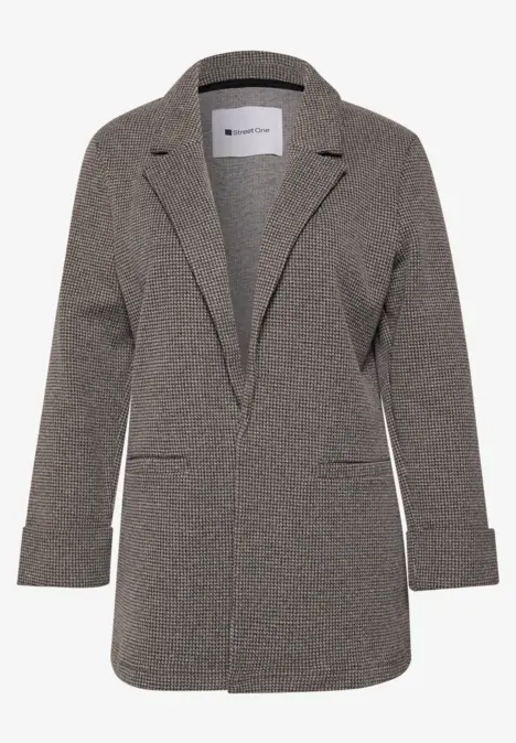 Veste blazer grise en tissu fin, col à revers, manches longues et poches plaquées.