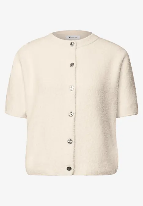 Korte crème teddyvest met ronde hals en knoopsluiting.