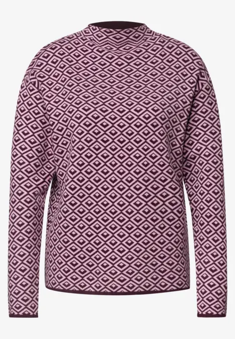 Damenpullover in Pink mit weißem Rautenmuster, lange Ärmel und Rundhalsausschnitt.