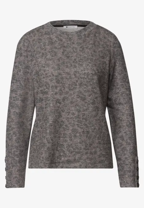 Pull gris à motif floral discret, manches longues, coupe décontractée.