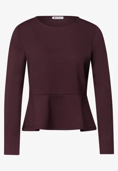 Dunkelrotes Langarmshirt mit figurbetonter Taille und leicht ausgestelltem Saum.