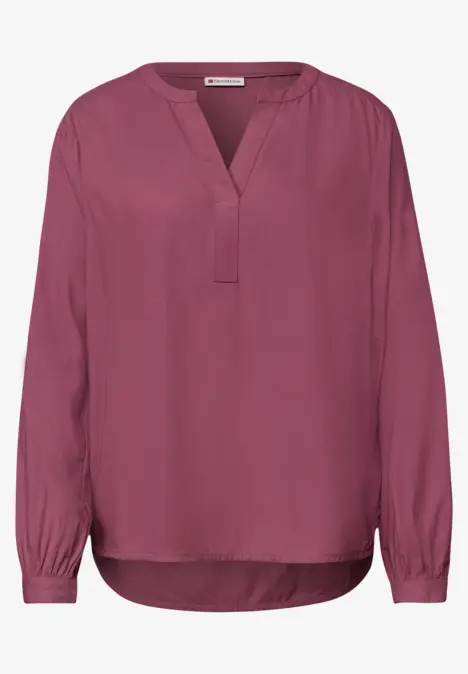 Damenbluse mit langen Ärmeln und V-Ausschnitt in kräftigem Pink.
