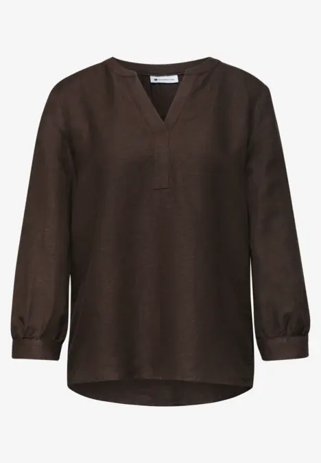 Donkerbruine, losse blouse met lange mouwen en V-hals.
