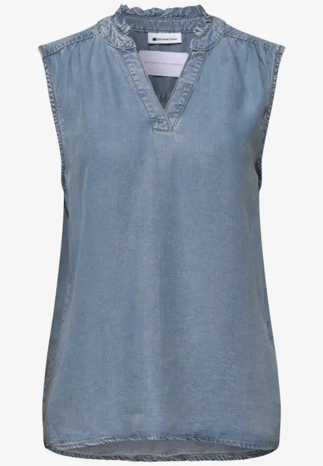Ärmellose Jeansbluse mit V-Ausschnitt und verspieltem Rüschenkragen.