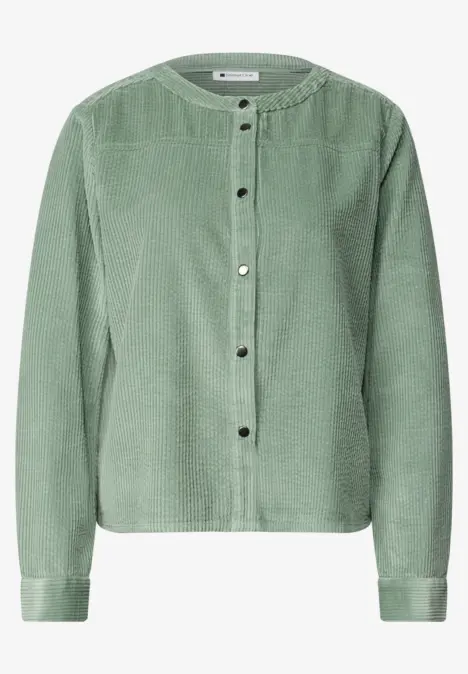 Veste en velours côtelé verte, col rond, boutons argentés et coupe décontractée.