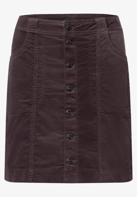 Jupe courte en velours côtelé marron, boutonnée devant, avec poches et passants de ceinture.