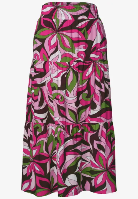 Langer, bunt gemusterter Maxirock mit pink-grünen Blatt-Designs.