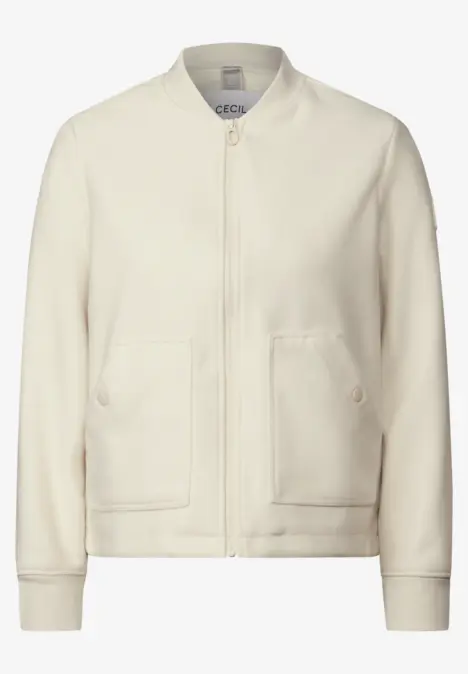 Cremefarbene Jacke mit Reißverschluss und zwei Taschen.