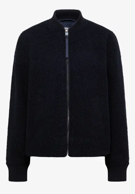 Schwarze Teddy-Fleecejacke mit Reißverschluss, Rippenbündchen an Ärmeln und Kragen.