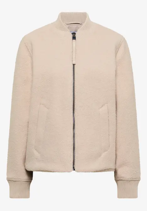 Cremefarbene Teddy-Fleece-Bomberjacke mit Reißverschluss und Stehkragen.