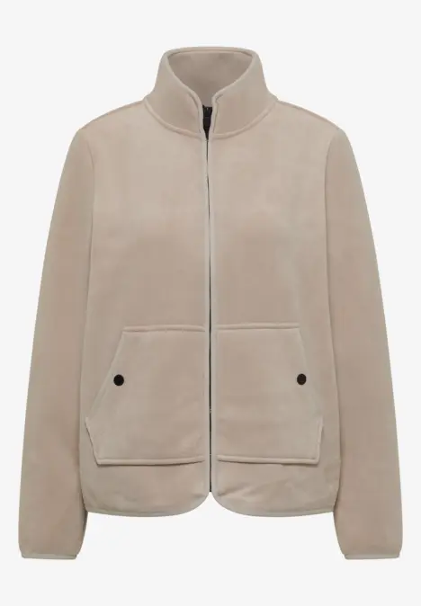 Veste beige zippée avec col montant et deux poches plaquées, style épuré et moderne.