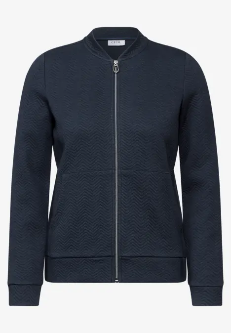 Dunkelblaue Damenjacke mit Reißverschluss und dezentem Muster.
