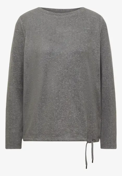 Graues, glitzerndes Langarmshirt mit Rundhalsausschnitt und seitlicher Bindeschnur am Saum.