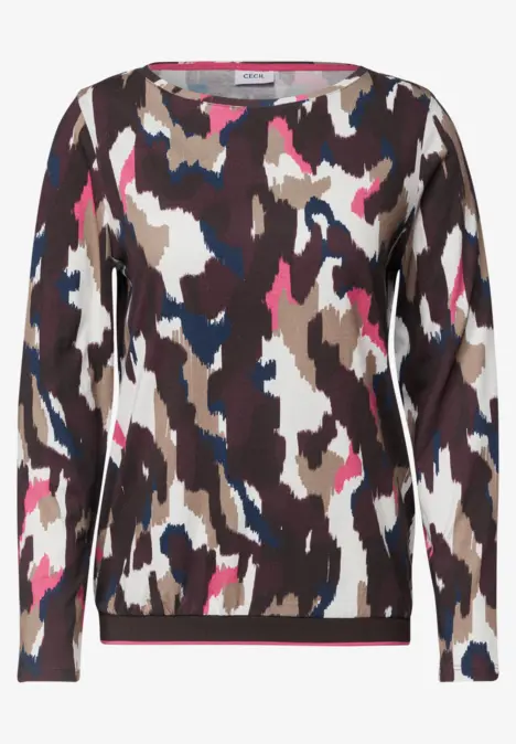 Haut à manches longues pour femme avec motif camouflage coloré en marron, blanc, bleu et rose.