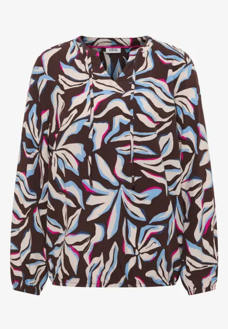 Blouse à manches longues avec motif de feuilles abstrait blanc, rose et bleu clair sur fond foncé.