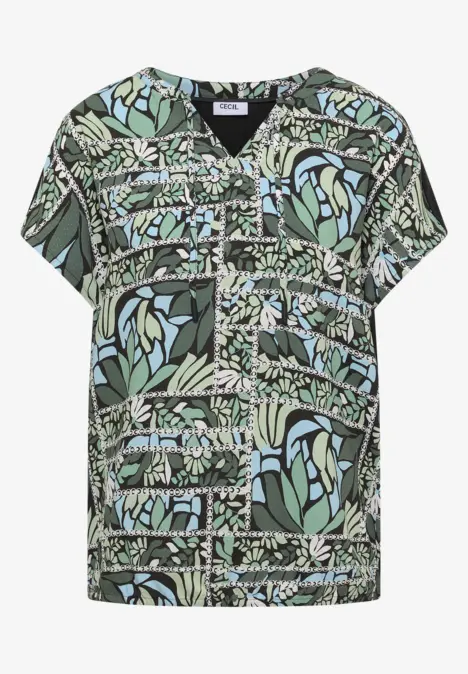 T-shirt vert à col en V avec motifs floraux et formes géométriques abstraites.