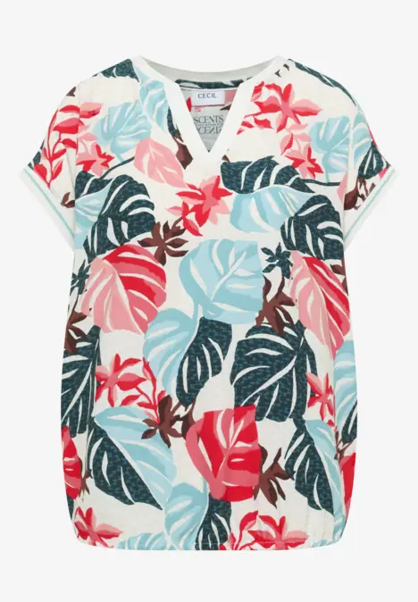 Blouse à motif feuillages tropicaux colorés.