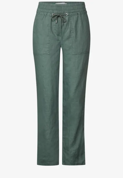 Grüne Leinenhose mit Gummibund und Kordelzug, zwei große Taschen vorne.